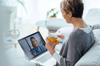 Woman-using-laptop-and-having-video-call-with-her-doctor-while-sitting-at-home.-1216972964_5472x3648-1