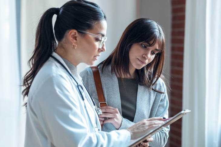 female-latin-american-adult-patients-clinic-explaining-medical-treatment-print-1