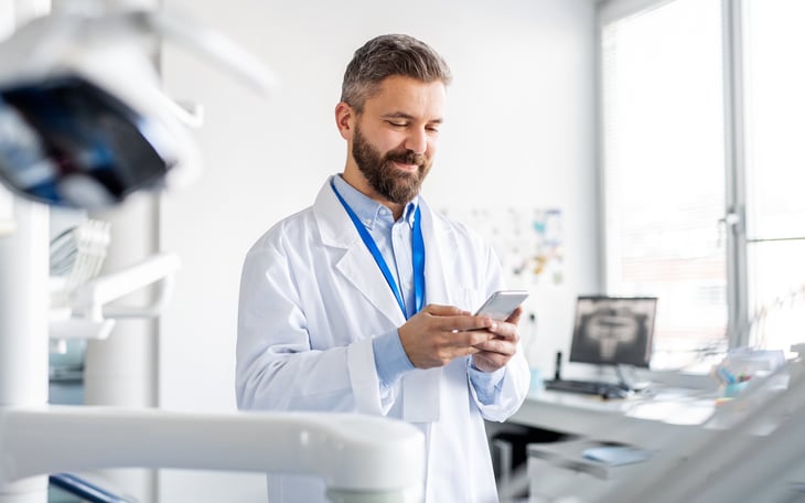 male-european-adult-doctor-consultation-room-dentist-in-modern-dental-surgery-print